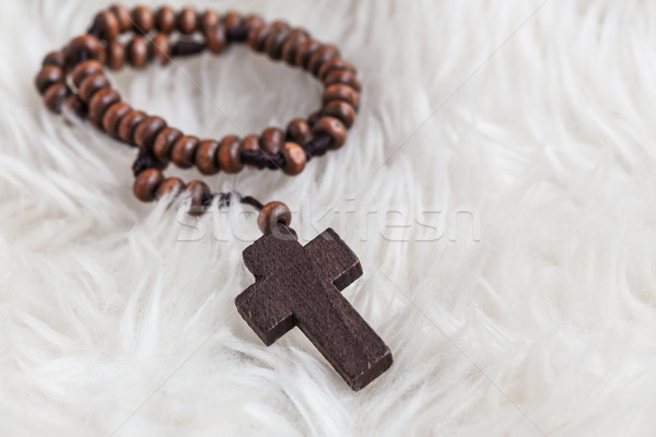 Christian cross necklace on sheep wool, Jesus religion concept a Stock photo © FrameAngel