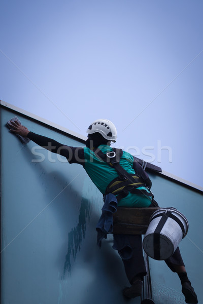 group of workers cleaning windows service on high rise building Stock photo © FrameAngel