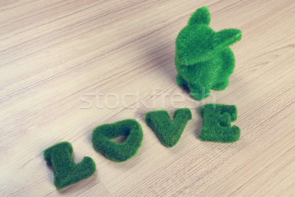 green love wording and little rabbit on wooden floor, made from Stock photo © FrameAngel