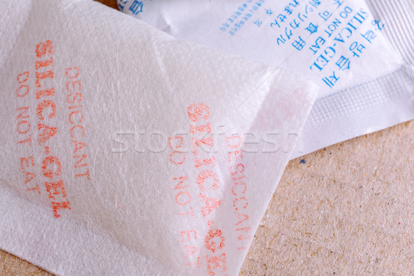 Close up silica gel or desiccant in paper bag background Stock photo © FrameAngel