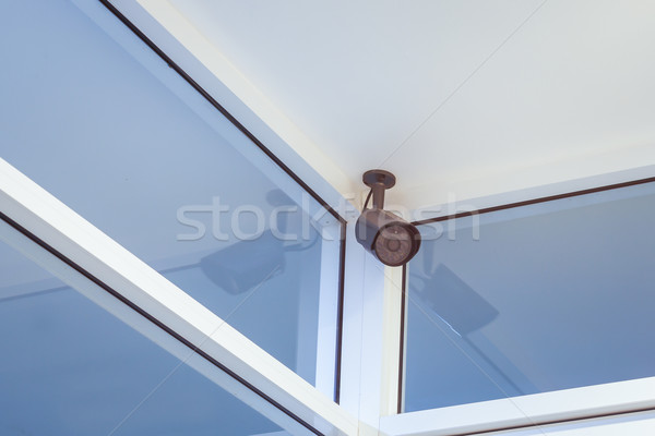 cctv camera security on wall background in room for safety conce Stock photo © FrameAngel