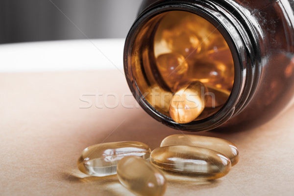 Yellow pills and bottle close up Stock photo © FrameAngel