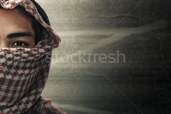 Stock photo: terrorists half face and eyes contact with masked and grunge bac