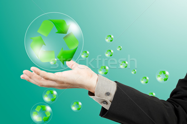 Recycle sign on business hand Stock photo © FrameAngel