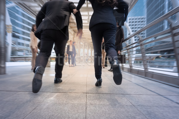 Biznesmen kobieta śpieszyć się w górę uruchomiony działalności Zdjęcia stock © FrameAngel