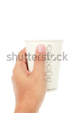 hand holding Paper cup of coffee and menu on white background Stock photo © FrameAngel