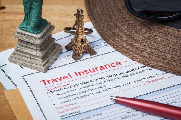 Travel Insurance Claim application form and hat with eyeglass an Stock photo © FrameAngel