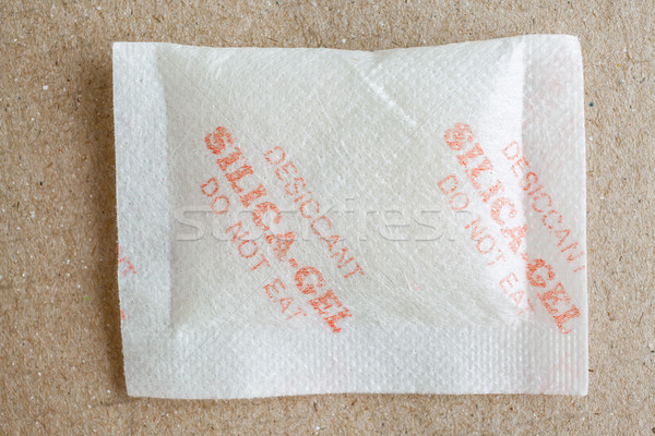 Close up silica gel or desiccant in paper bag background Stock photo © FrameAngel