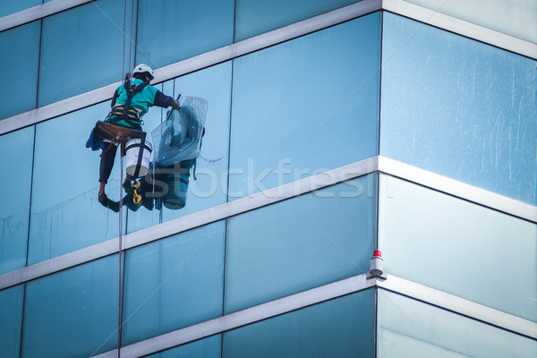 group of workers cleaning windows service on high rise building Stock photo © FrameAngel