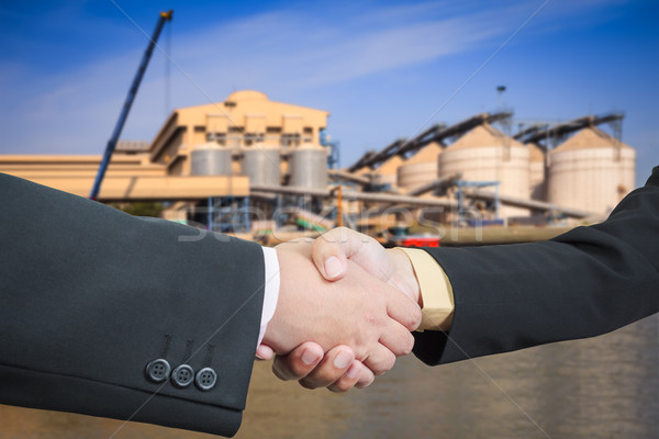 Businessman handshake with silo transportation logistic backgrou Stock photo © FrameAngel