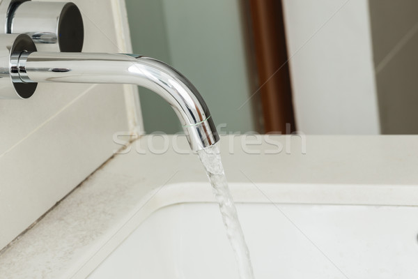 Water tap with flowing water Stock photo © FrameAngel