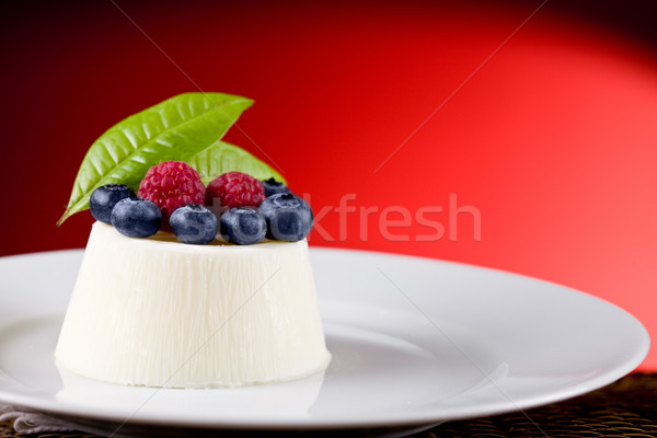 Panna cotta with Berries on red background Stock photo © Francesco83