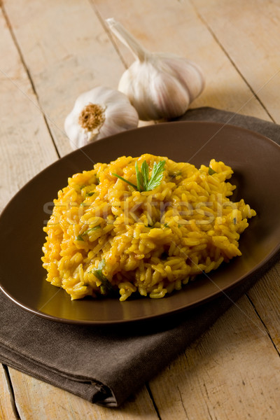 Risotto saffraan houten tafel heerlijk knoflook servet Stockfoto © Francesco83