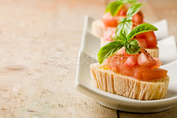Bruschetta domates fesleğen fotoğraf lezzetli ahşap masa Stok fotoğraf © Francesco83