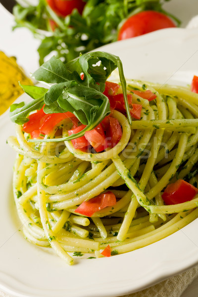 Stock photo: Pasta with arugula pesto and cherry tomatoes