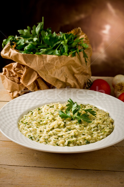 Risotto hierbas foto delicioso plato mesa de madera Foto stock © Francesco83