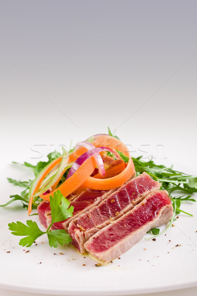 Chopped Tuna over fresh arugula salad Stock photo © Francesco83