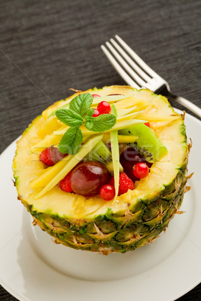 Stock photo: Pineapple stuffed with fruits