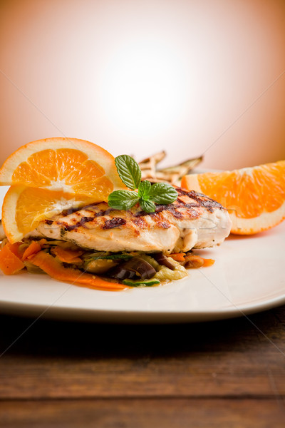 [[stock_photo]]: Poulet · grillé · sein · lit · délicieux · orange · lumière