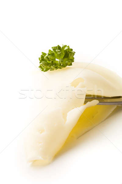 Stock photo: Slice of Cheese with parsley on fork
