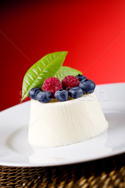 Panna cotta with Berries on red background Stock photo © Francesco83