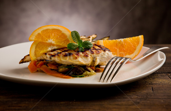 [[stock_photo]]: Poulet · grillé · sein · lit · délicieux · orange · lumière