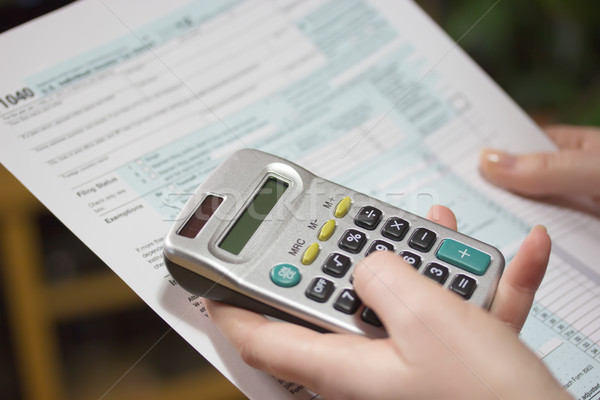 Filling income tax forms with calculator  Stock photo © frank11