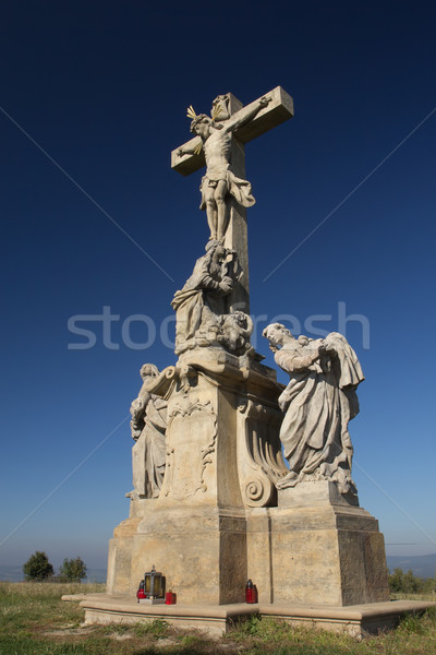 Statue of Jesus Christ on a cross. Blue sky in the background.  Stock photo © frank11