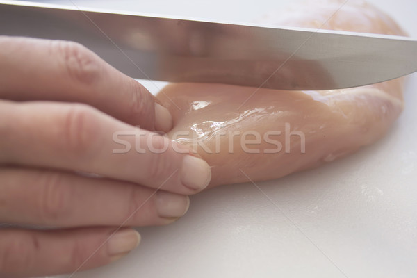 Nők kéz szeletel csirkemell kés fehér Stock fotó © frank11