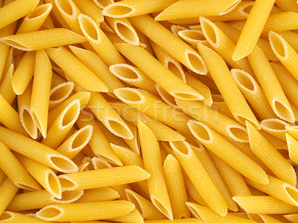 Closeup Background of Uncooked Italian Penne Pasta Stock photo © Frankljr