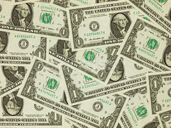 A Pile Of One Dollar Bills As A Money Background Stock Photo