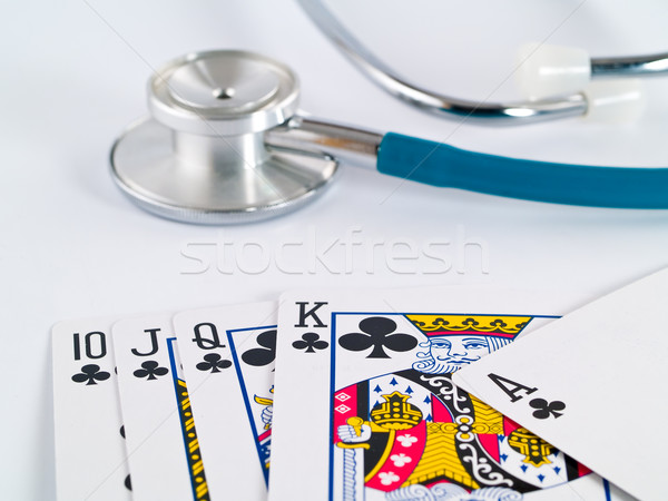 Stetoscopio carte da gioco gioco d'azzardo faccia medicina carta Foto d'archivio © Frankljr