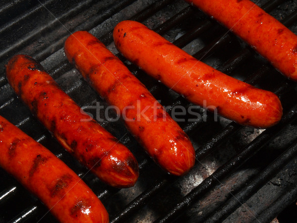 A row of five hotdogs on a bbq grill Stock photo © Frankljr