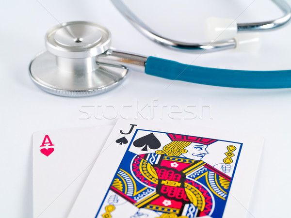 Stetoscopio carte da gioco gioco d'azzardo faccia medicina poker Foto d'archivio © Frankljr