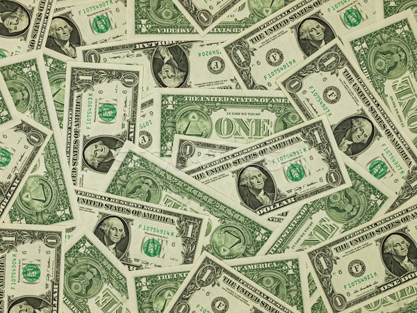 A Pile Of One Dollar Bills As A Money Background Stock Photo