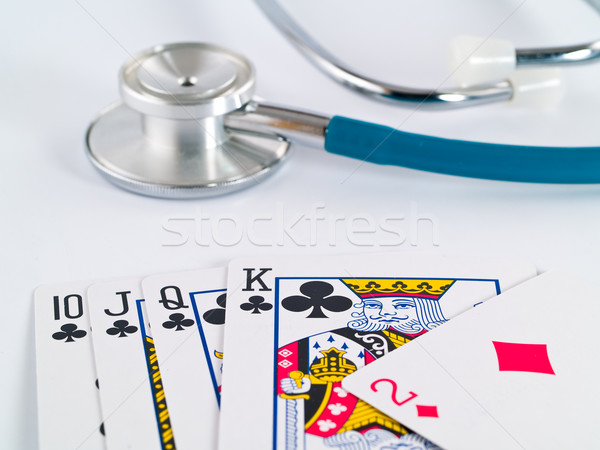 Stetoscopio carte da gioco gioco d'azzardo faccia medicina poker Foto d'archivio © Frankljr