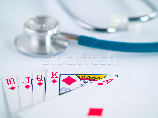 Stetoscopio carte da gioco gioco d'azzardo faccia medicina poker Foto d'archivio © Frankljr