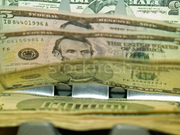 An electronic money counter processing US $5 bills Stock photo © Frankljr