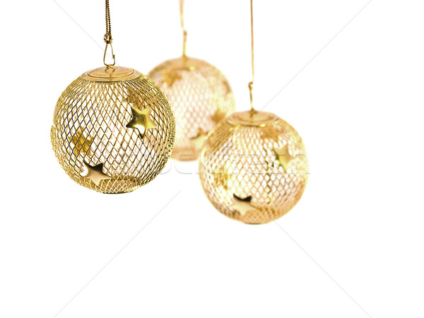 A hollow gold wire mesh Christmas ornament with stars Stock photo © Frankljr