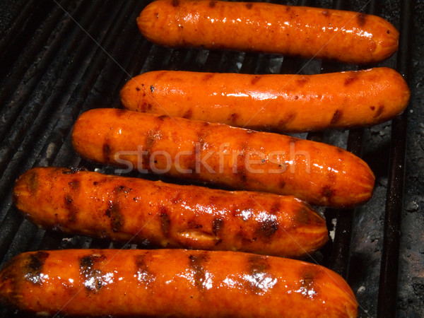 A row of five hotdogs on a bbq grill Stock photo © Frankljr