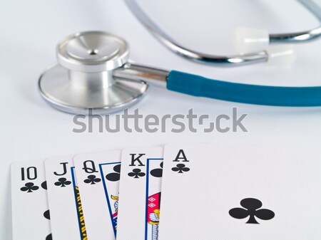 Stetoscopio carte da gioco gioco d'azzardo faccia medicina poker Foto d'archivio © Frankljr