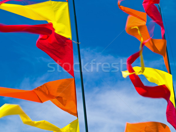 Сток-фото: красный · оранжевый · желтый · флагами · Blue · Sky