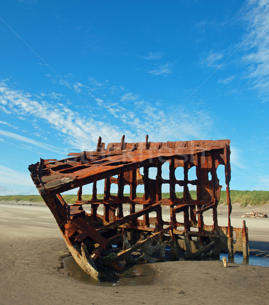 Rusty Wreckage of a Ship on a Beach Stock photo © Frankljr
