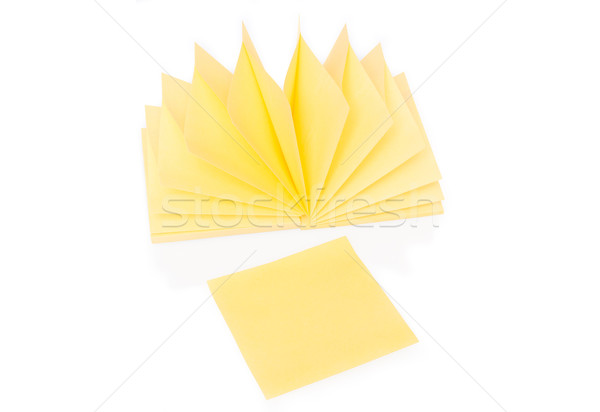 Stock photo: Blank yellow sticky note and block on white