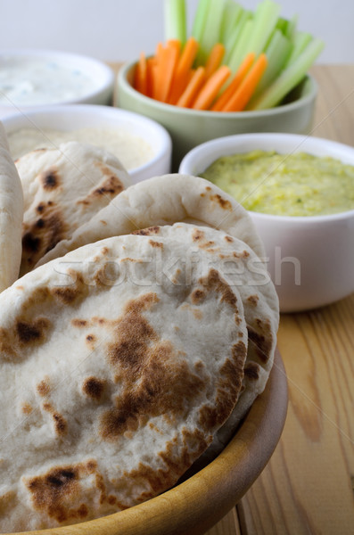 Pitta Breads with Dips Selection and Crudites on Wooden Table Stock photo © frannyanne