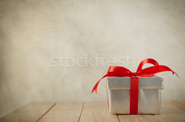 Single Silver Gift Box with Red Bow Stock photo © frannyanne