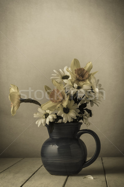 Old Fading Flowers in Blue Jug Stock photo © frannyanne