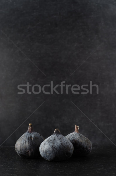 Three Figs Grouped on Black Stock photo © frannyanne