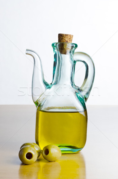 Jug of Olive Oil with Olives Stock photo © frannyanne