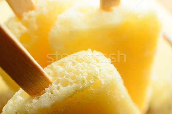 Yellow Pineapple Ice Lollies in Close Up with Wooden Sticks Stock photo © frannyanne